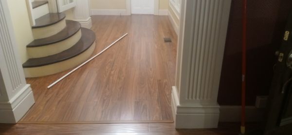 Hardwood flooring installation in home entryway