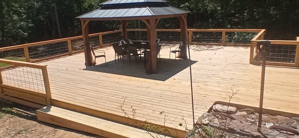 Large deck with gazebo and cable railing